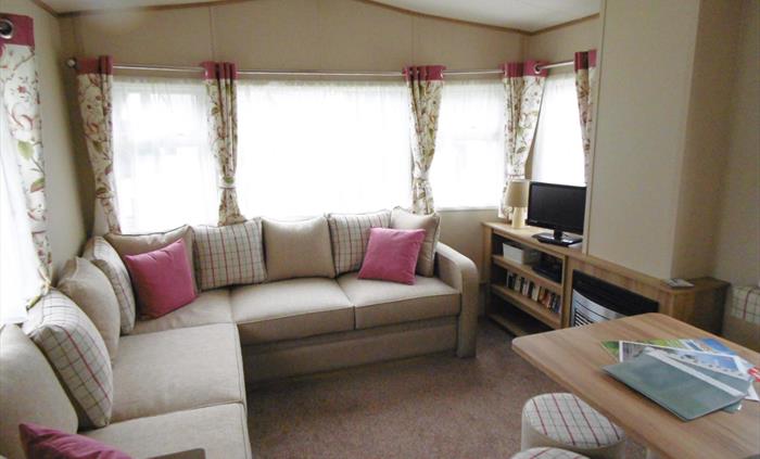 Larch caravan lounge and dining area